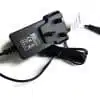 Black power adapter with cord on white background.