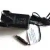 Black AC power adapter with cord on white.