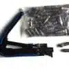 Crimping tool and assorted electrical connectors on white.