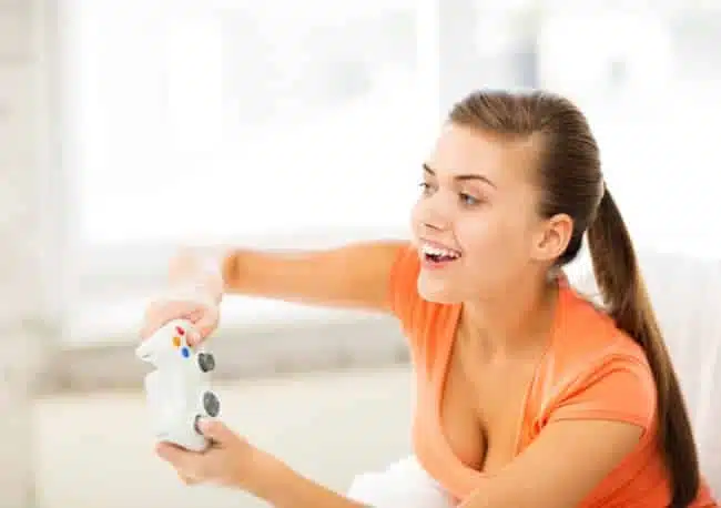 woman with joystick playing video games