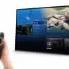 Woman using remote to navigate smart TV interface.